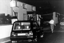 A hearse arrives at O'Tooles bar, Loughlinisland, in preparation for the removal of the bodies, 19 June 1994