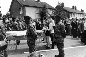 Joe McDonnell's coffin with his wife Goretti and their children Bernadette and Joseph