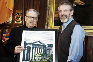 Gerry Adams being presented with one of the Robert Ballagh’s prints by the artist
