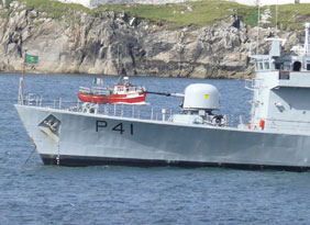 UNDER THE SHADOW OF A GUN: Fishing boat dwarfed by the LE Orla off the Mayo coast