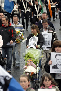 REMEMBRANCE: People in the parade carried portraits of local republican dead