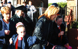 HOLY CROSS: Schoolgirls are terrorised by unionist mobs