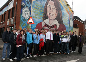 SEACHTAIN NA GAEILGE: Pupils from Coláiste Feirste and the Irish language college in Ballinderry, County Cork with Sinn Féin President Gerry Adams at Sevastopol Street in West Belfast