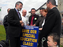 FIGHTING TALK: Gerry Adams and John Brady (centre) talk to worried Wicklow residents about the cuts in education