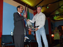 FUNCTION: Gerry Kelly presents funds collected by Sinn Féin to Noel Carillo