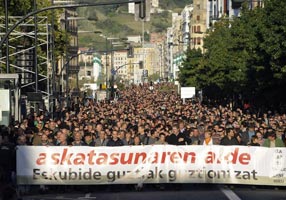 TAKING TO THE STREETS: Thousands of supporters march behind a banner reading ‘For Freedom. Rights for All’ in protest at the recent arrests
