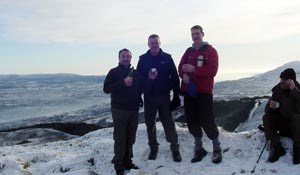 Newry/Armagh MP Conor Murphy MLA and his colleagues Councillors Terry Hearty and Pat McGinn make a toast to all Irish emigrants from the top of Camlough Mountain last Christmas morning