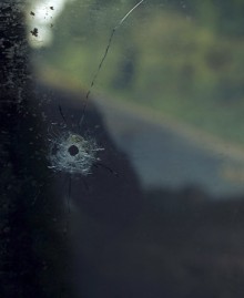 Bullet Hole in Wndow  -Aftermath Exhibition