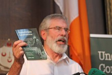Gerry Adams with UC book