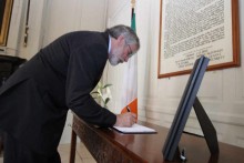 Gerry Adams signing book of condolence