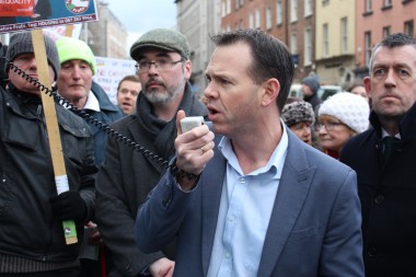 John Brady TD addressing the crowd outside Leinster House at today's pension demonstration