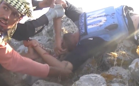 Wounded Syrian Rebel wearing stolen UN fatigues
