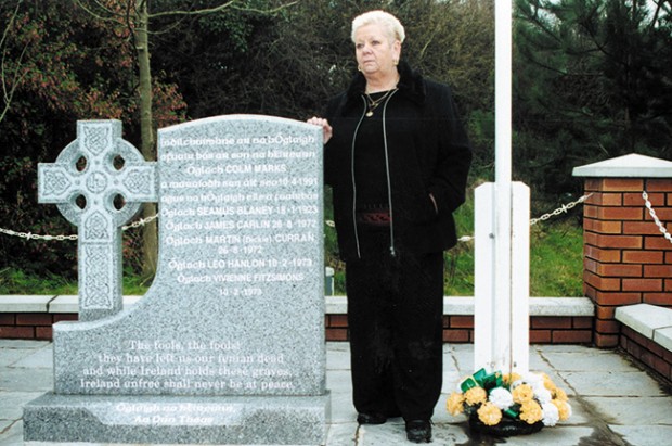 Colum Marks’s mother, Roisín, stands at the memorial to Volunteers from South Down, including her son Colum