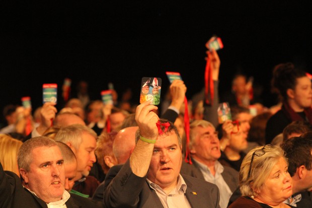 Delegates voting of policy at a Sinn Féin Ard Fheis.