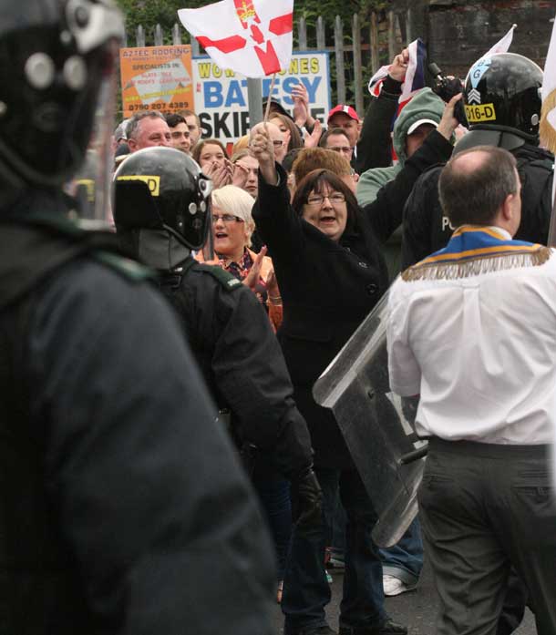 Loyalist supporters descend on Ardoyne during the return leg of the parade