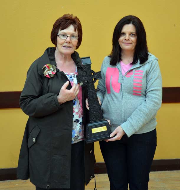 Anne Caldwell (left), cousin of Tobias, is presented with an inscribed Celtic cross by Molloy/Devlin/McCauley Sinn Féin Cumann member Anne-Marie Love on behalf of the Sinn Féin Tyrone Commemoration Committee