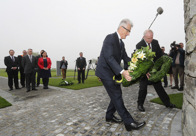 Martin McGuinness lays a wreath at the First World War monument in Flanders alongside Geert Bourgeois, Minister-President of Flanders.