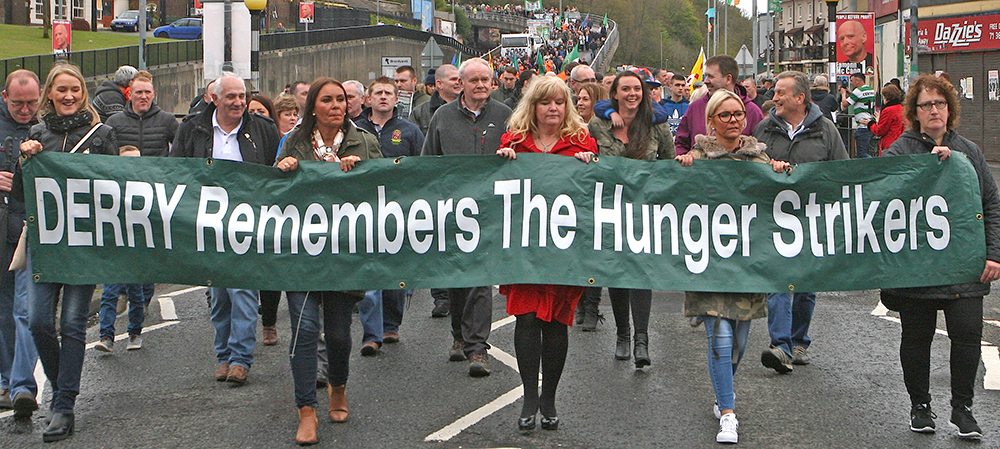 The extent of the crowd can be seen as it passes along the flyover leading into the Bogside