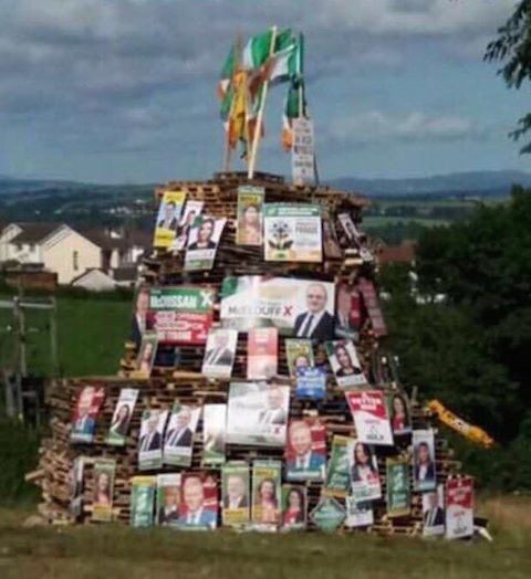 Election posters on a loyalist bonfire.