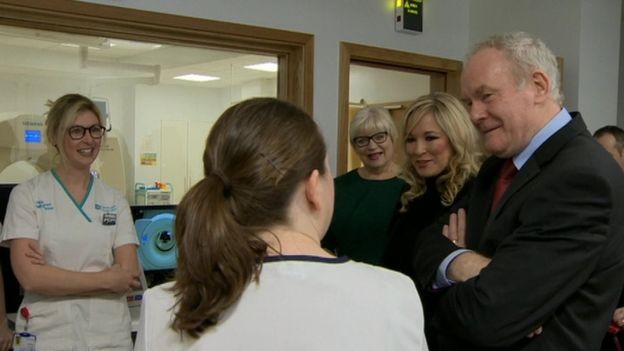 The late Martin McGuinness and then Health Minister Michelle O'Neill speaking to staff at the North West Cancer Centre.