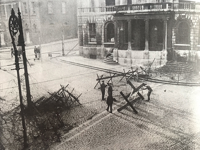 British Army surrounding City Hall with barbed wire barricade after they occupied it on 20 December 1920