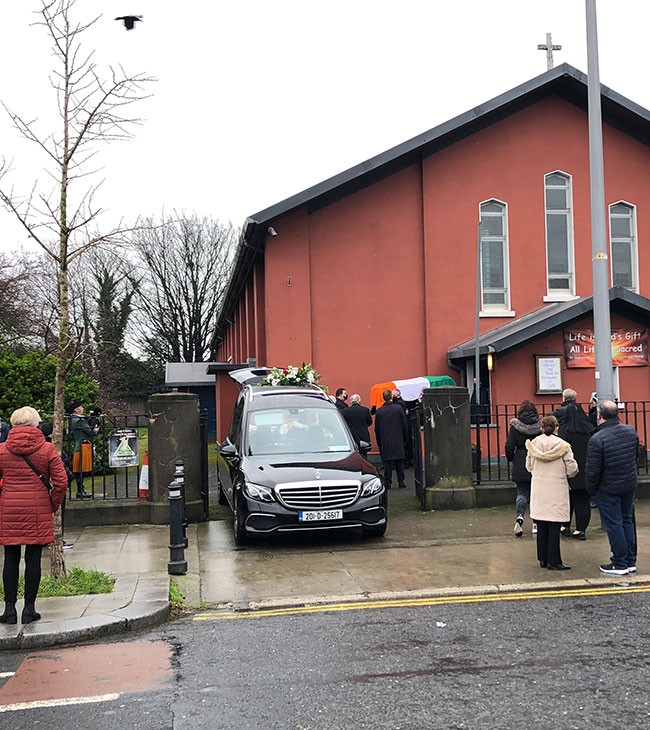 Hughie's coffin leaving church