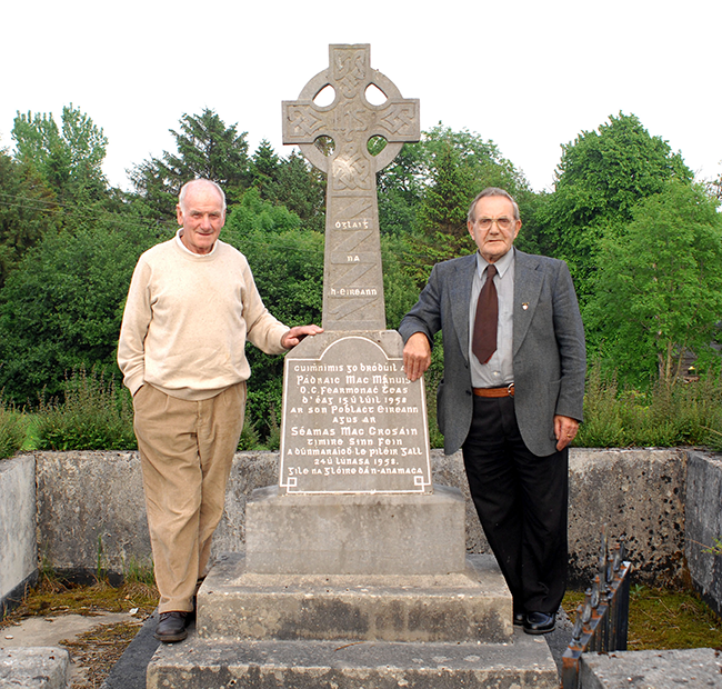 Patrick Murphy (left) with John Owens at the monument erected at the spot where Volunteer Patrick McManus was killed.