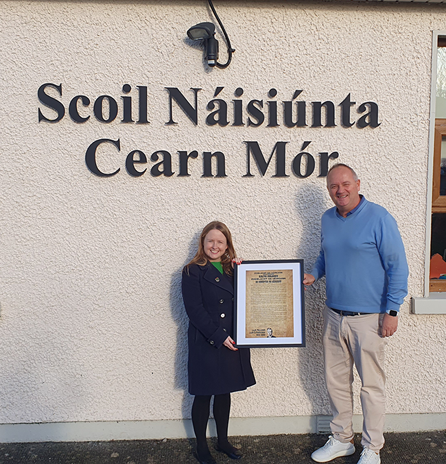 Mairéad Farrell TD presenting a Liam Mellows Proclamation to the Principal of Carnmore N.S. in a parish that saw clashes