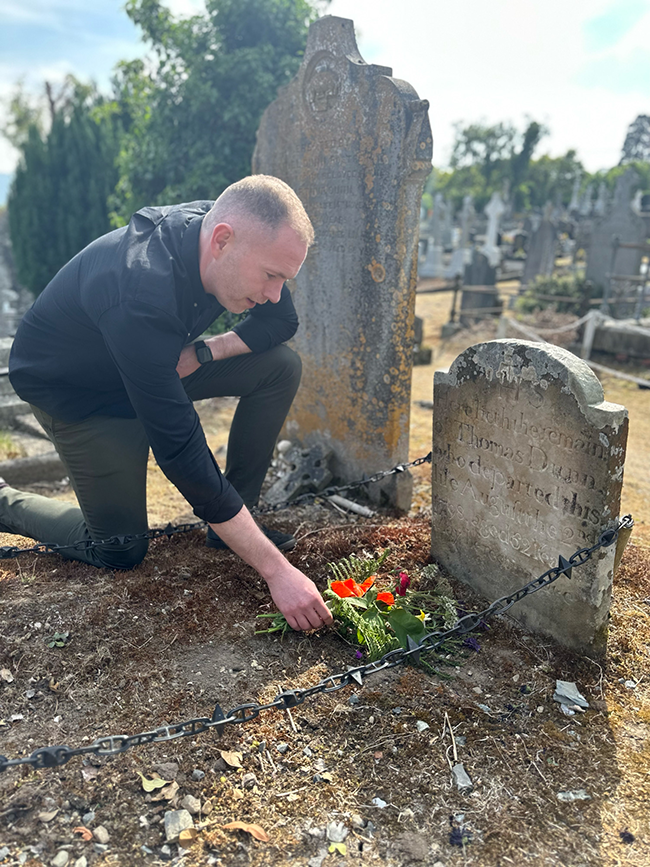 Chris Hazard at the grave of Tom Dunn in Rostrevor