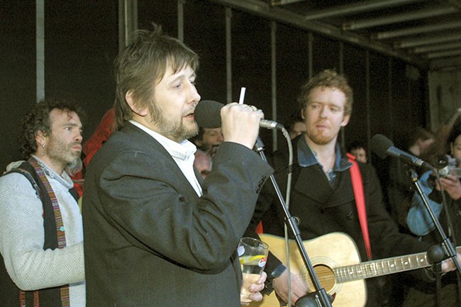 • Shane singing during an Anti War Protest, Central Bank, Dublin, February 2003