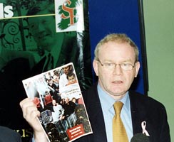 Martin McGuinness holds a copy of the launched dossier