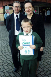 Michael Ferguson and bairbre de Brún with a young participant in the Youth Safety Week