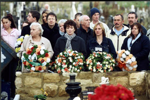 Relatives gather in Milltown cemetery