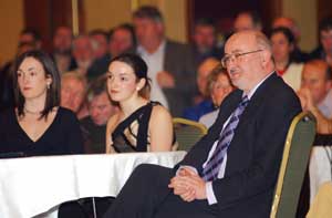 Caoimhghín Ó Caoláin listens on with daughters Sinéad and Cliodhna