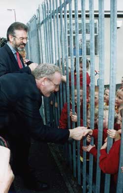 Martin McGuinness with schoolchildren