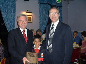 Gerry Kelly presents John McDonnel with a plaque