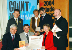 Alex Maskey (right) signed an anti-racism election protocol on behalf of Sinn Féin to mark Anti-Racism Day