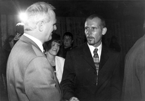 The DUP's Willie McCrea is pictured greeting loyalist killer Billy Wright