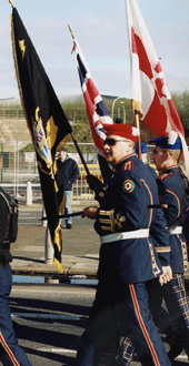 Orange marchers pass the Short Strand nationalist enclave in East Belfast
