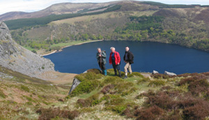 Former POWs Gay Clery, Eddie O'Neill and Liam McCotter with Wicklow's Lough Tay in the background