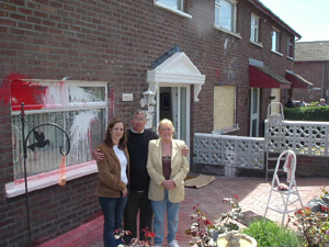 Sinn Féin MLA Kathy Stanton and Councillor Briege Meehan with William Sheppard, whose home, and those of his neighbours, was attacked with paint bombs