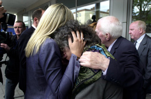 Annie Massey, whose daughter was killed, is comforted by members of her family after the inquest verdict was delivered