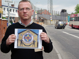 Anti-collusion campaigner Sean Osborne displays the loyalist death threat he received