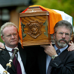 Gerry Adams and Martin McGuinness carry Joe Cahill's coffin