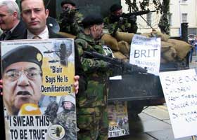 Members of the South Armagh Demilitarisation Committee protest outside Leinster House