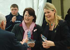 Fermanagh/South Tyrone MP Michelle Gildernew and Kerry Councillor Toireasa Ní Fhearaíosa chat with visitors to the Sinn Féin marquee