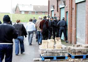 PSNI raid business and community units in the Dairy Farm complex on the Stewartstown Road