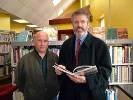 Gerry Adams with James McKeown in Carnlough Library, which the party is campaigning to save from closure