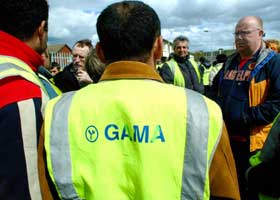 Sinn Féin councillors Dessie Ellis and Ray Corcoran talk to Gama workers in Ballymun