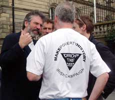 Gerry Adams chats with Fr Eamon Stack, who ministered in Portadown during the worst of the Drumcree tensions in the mid to late 1990s, at the rally